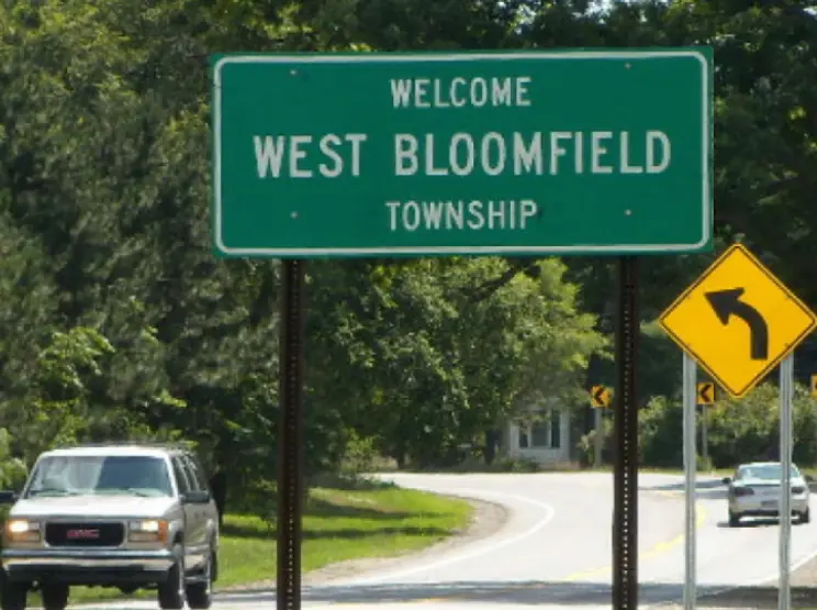 Green highway sign reading Welcome to West Bloomfield Township in West Bloomfield, Michigan